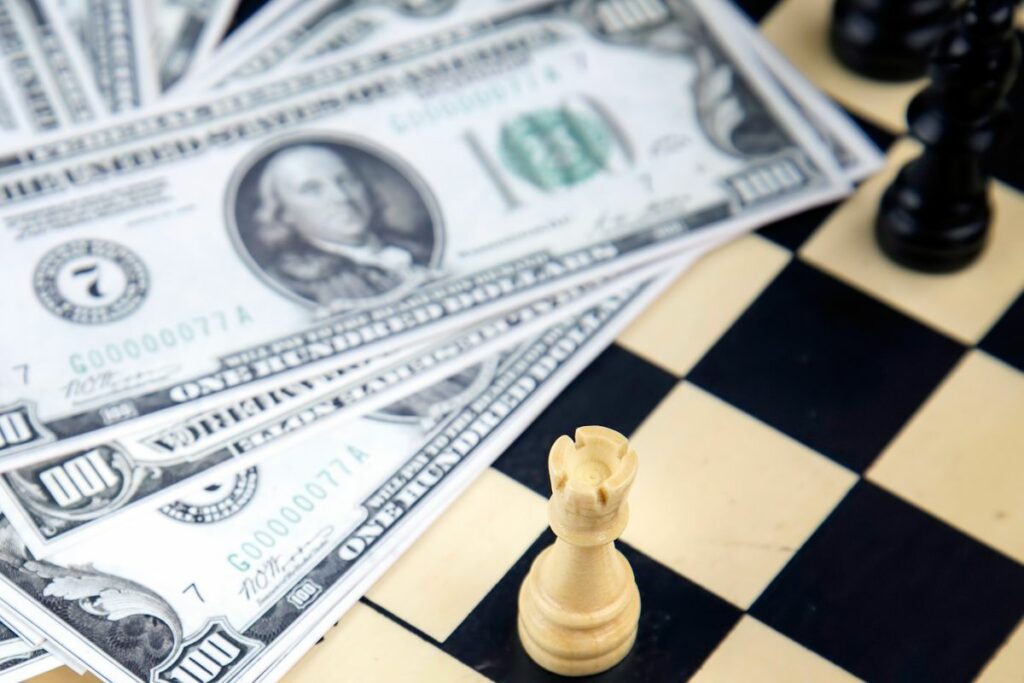 a photo of a chess board with money on it to answer can you make money from chess