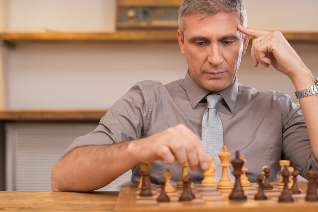 a photo of a chess player to answer how does chess affect memory