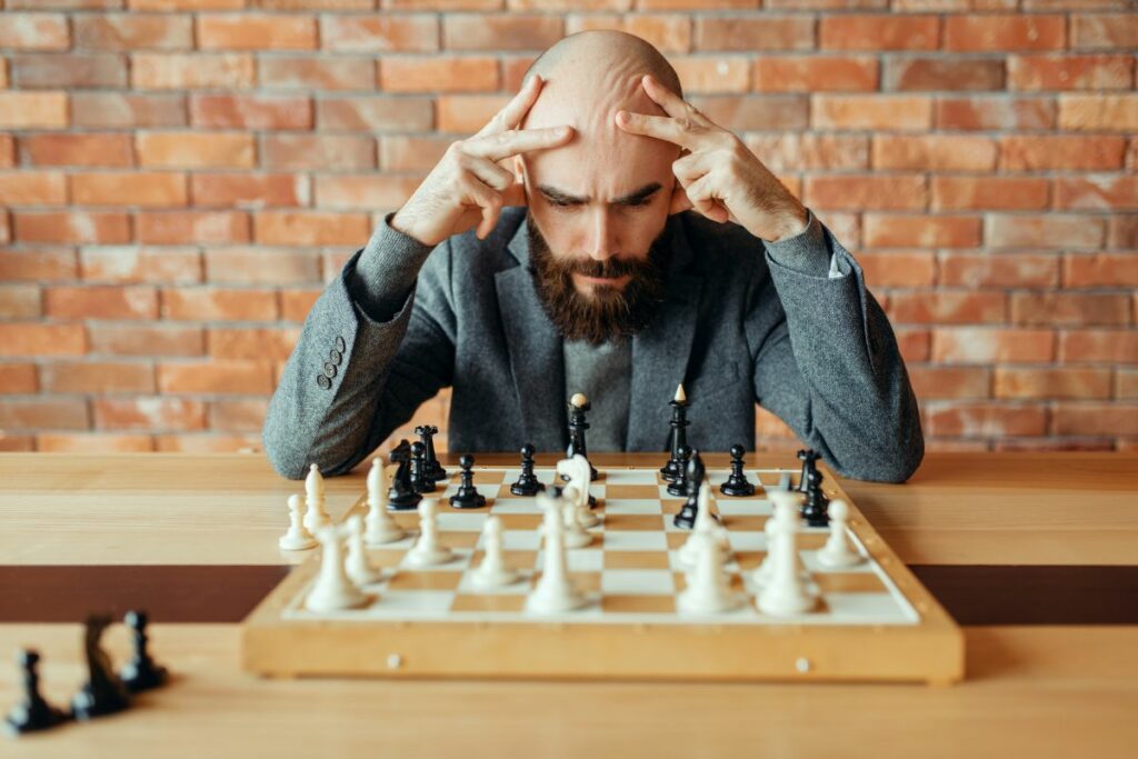 a photo of a chess player to answer why is chess stressful 