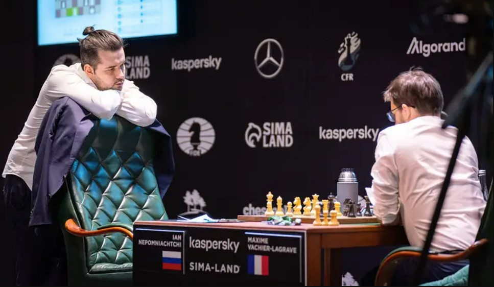 a photo of a chess player standing to show why do chess players leave the table